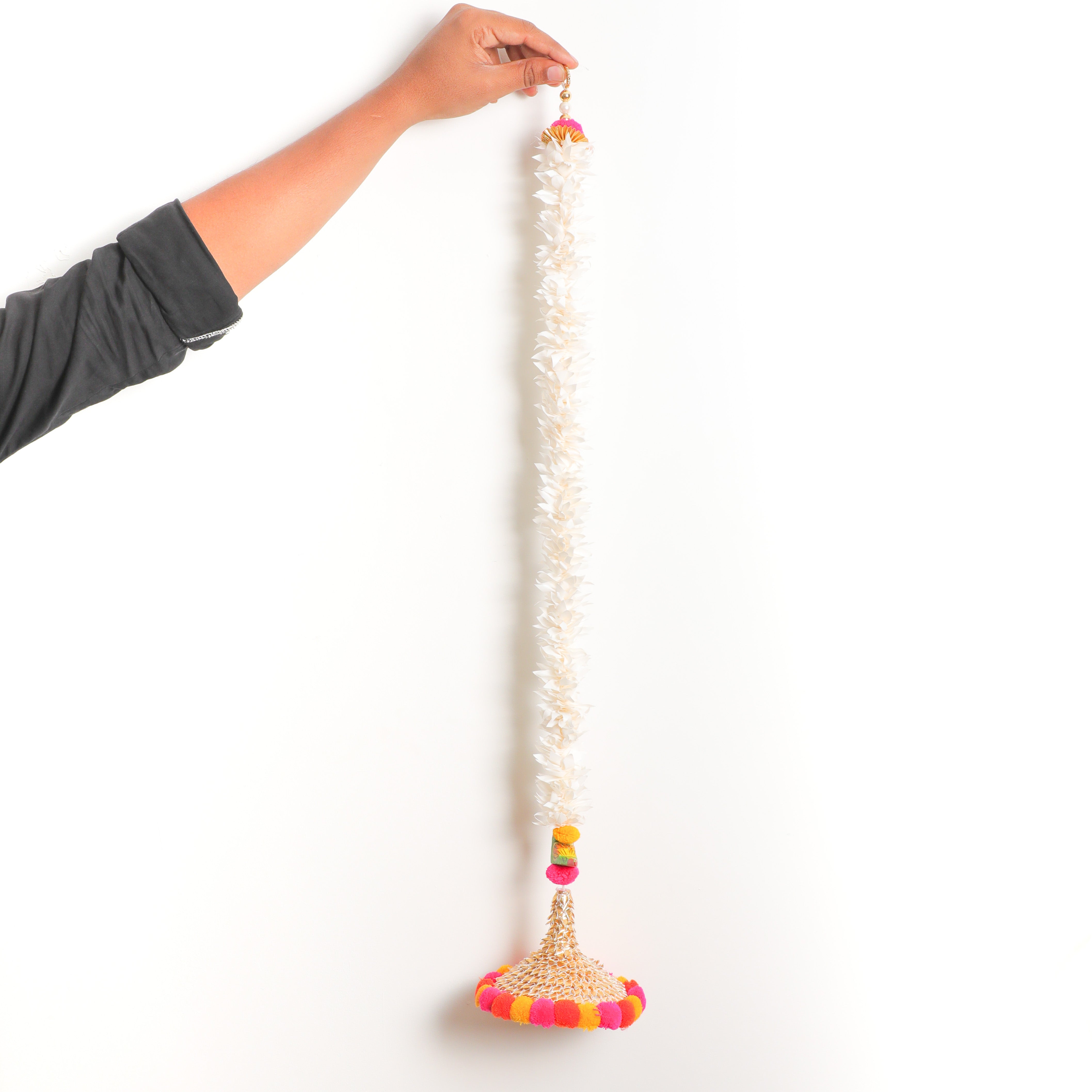 Gajra Parrot Hanging Garland comes with a loop at the top which makes it easy to hang anywhere.