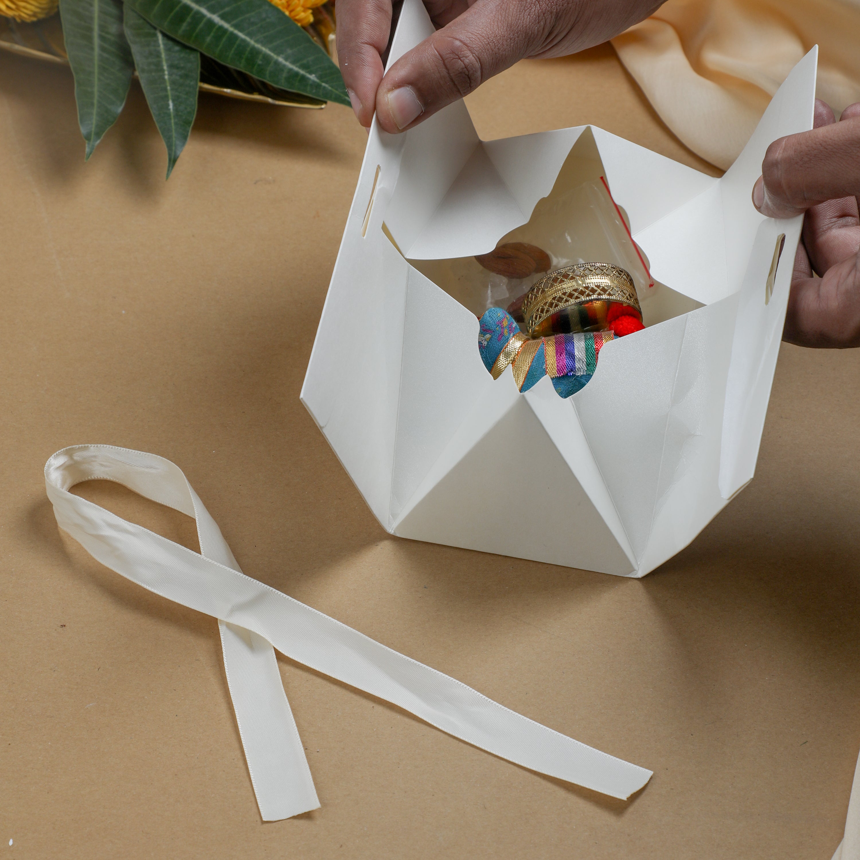 It comes beautifully packed in a decorative triangular box