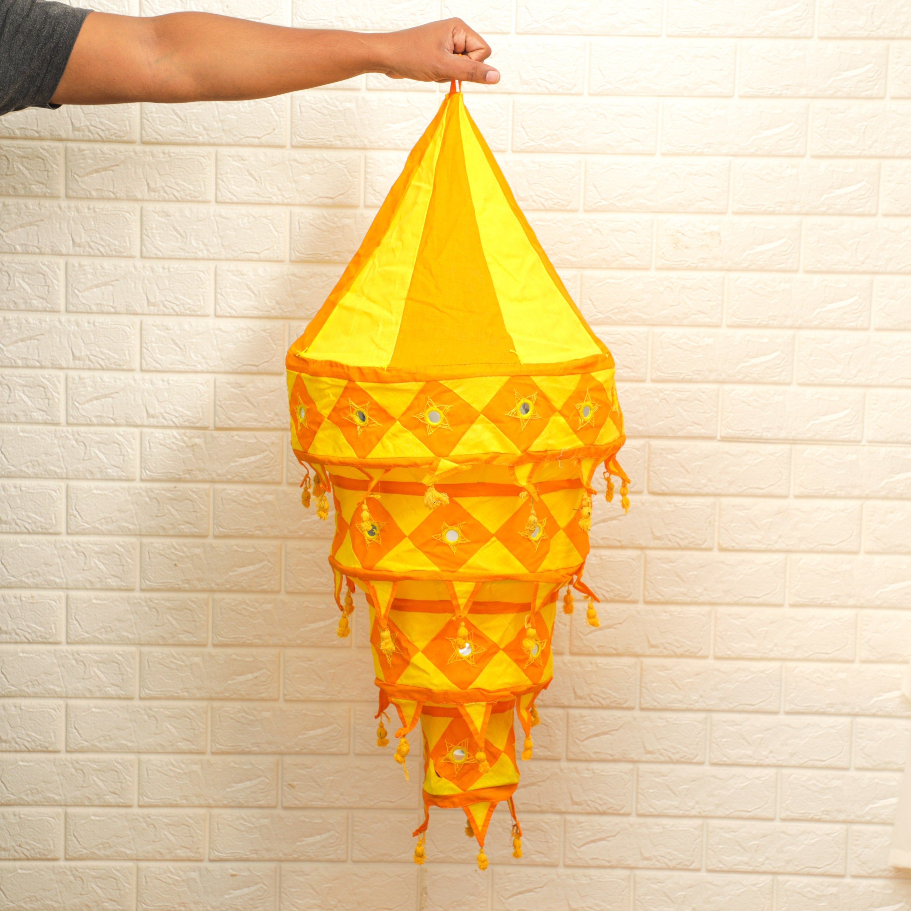 A beautifully designed Cotton Fabric Lantern, featuring a warm and soft cotton shade, casting a cozy light into any room. Perfect for adding style and ambiance to your home décor.