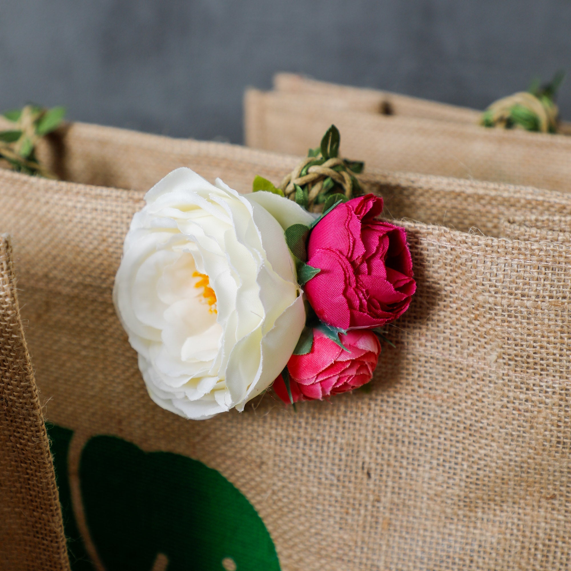 The top is adorned with lovely flowers, adding a touch of elegance to this bag