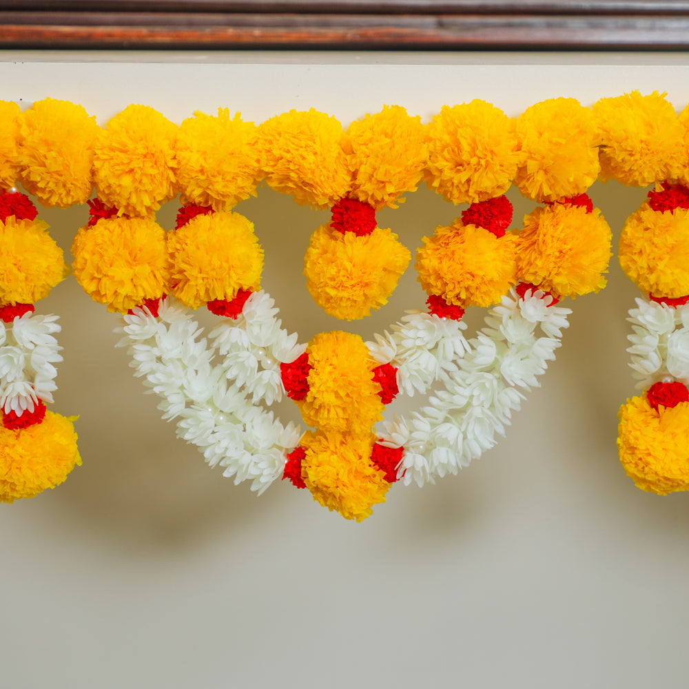 Celebrate the rich colors of tradition by decorating your doors with our Colorful Artificial Lilly & Marigold Traditional Toran