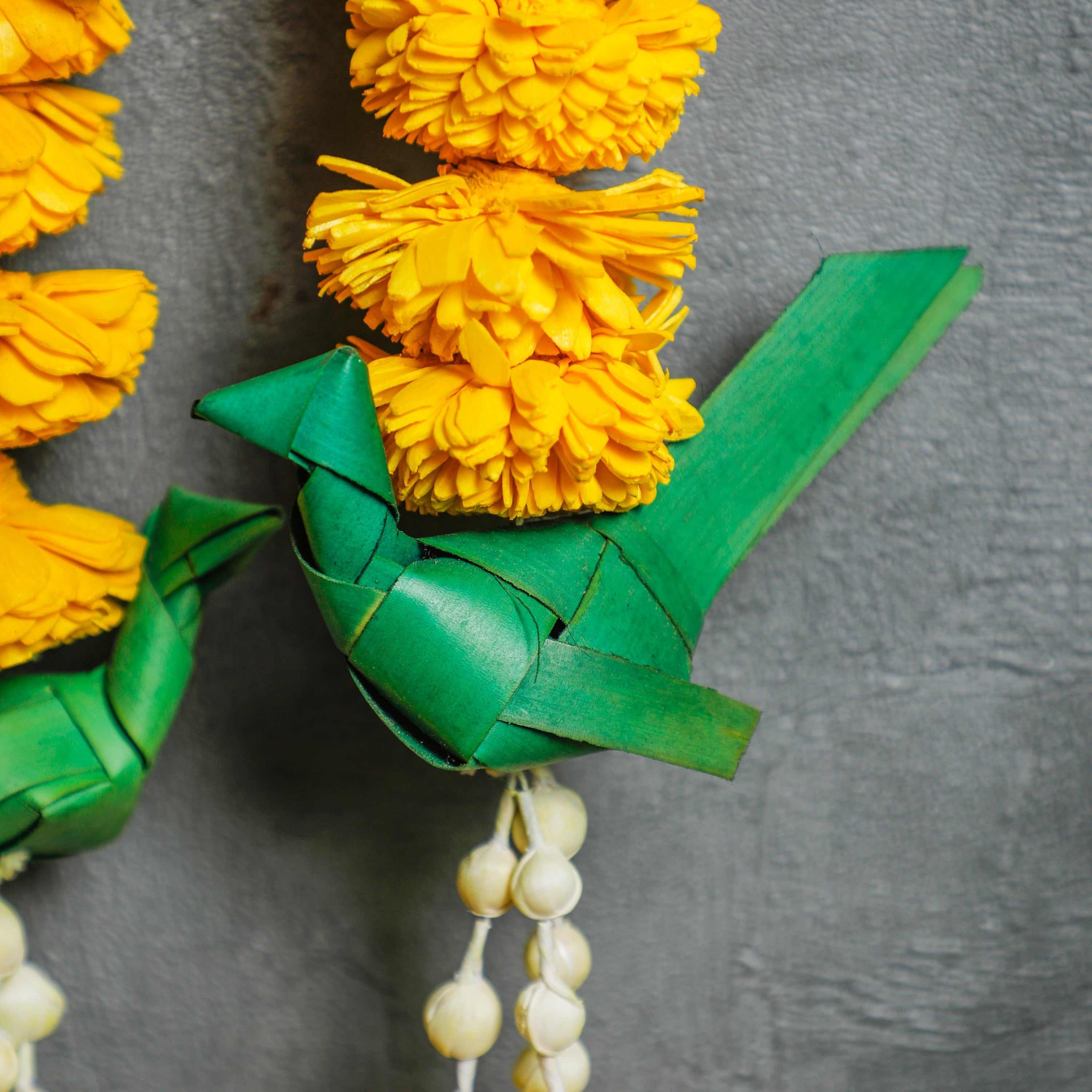 handmade parrot with palm leaves