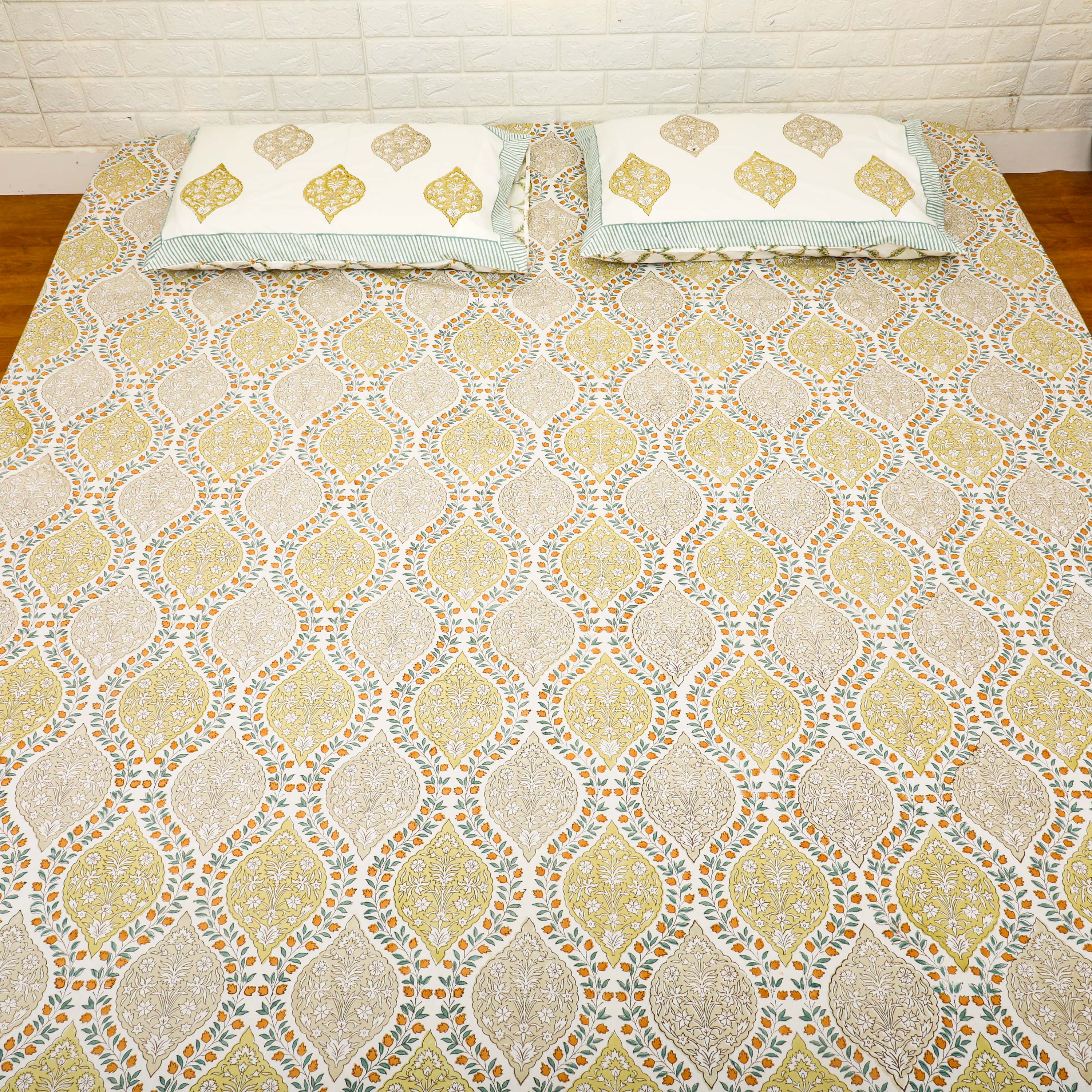 A subtle printed bedspread/bedsheet with reversible pillow cases